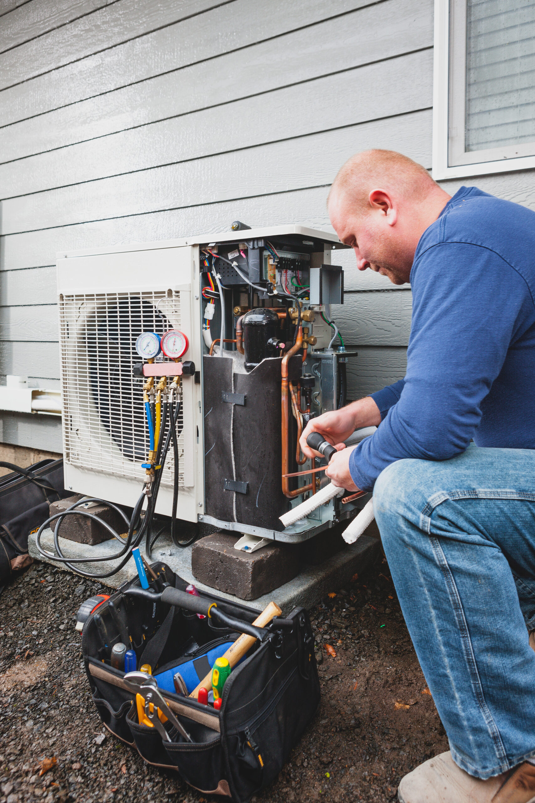 Man installing a residential HVAC product